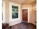 Inviting front entry with a brick walkway and stylish door at 1214 Romani Ave # 10240, Davenport, FL 33896