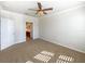 Spacious main bedroom with neutral decor and ample sunlight at 1214 Romani Ave # 10240, Davenport, FL 33896