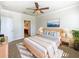 Bright and airy main bedroom with ensuite bathroom access at 1214 Romani Ave # 10240, Davenport, FL 33896