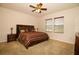 Spacious bedroom with a ceiling fan and a large window that lets in natural light at 1337 Glenleigh Dr, Ocoee, FL 34761