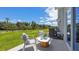 Private patio with seating area and grassy backyard view at 2163 Longleaf Rd, Davenport, FL 33837
