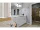 Bright bathroom with soaking tub, walk-in shower, and large vanity with storage at 219 Plumoso Loop, Davenport, FL 33897