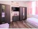 Two twin beds, large closets, and a TV in this bedroom at 219 Plumoso Loop, Davenport, FL 33897