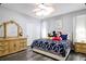 Spacious Primary bedroom with large bed and dresser at 219 Plumoso Loop, Davenport, FL 33897