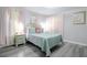 Serene bedroom with a queen bed, pastel accents, and lots of natural light at 219 Plumoso Loop, Davenport, FL 33897