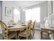 Bright dining room with a large table and chairs, perfect for Gathering gatherings at 219 Plumoso Loop, Davenport, FL 33897