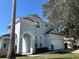 Beautiful two-story home featuring an arched entryway, two-car garage, and a well-maintained lawn at 219 Plumoso Loop, Davenport, FL 33897