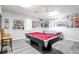 Game room with pool table, air hockey, and movie posters at 219 Plumoso Loop, Davenport, FL 33897