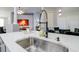 Modern kitchen with large island and sink at 219 Plumoso Loop, Davenport, FL 33897