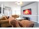 Comfortable living room with neutral tones, plush sofas, tv and an open floor plan at 219 Plumoso Loop, Davenport, FL 33897
