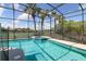 Refreshing pool and spa with a screened enclosure at 219 Plumoso Loop, Davenport, FL 33897