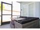 Screened patio with comfortable seating and table at 219 Plumoso Loop, Davenport, FL 33897