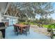 Backyard featuring a patio with dining, outdoor grilling, a fire pit, seating and shed at 228 Westwood Dr, Leesburg, FL 34748