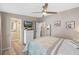 Bedroom with a bed, dresser, and ceiling fan at 228 Westwood Dr, Leesburg, FL 34748