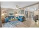 Living room with light blue sofas, coffee table, and wood-look floors at 228 Westwood Dr, Leesburg, FL 34748