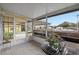Enclosed patio featuring tiled floor, large windows and sliding glass door access at 228 Westwood Dr, Leesburg, FL 34748