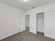 Bright bedroom with carpet flooring, a spacious closet, and an additional room at 248 Links Terrace Blvd, Daytona Beach, FL 32124
