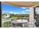 Private balcony with outdoor seating and scenic views at 263 Minorca Beach Way # 301, New Smyrna Beach, FL 32169