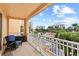 Private balcony with patio furniture and scenic community views at 263 Minorca Beach Way # 301, New Smyrna Beach, FL 32169