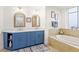 Elegant bathroom with double vanity, large soaking tub, and separate shower at 263 Minorca Beach Way # 301, New Smyrna Beach, FL 32169