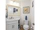 Small bathroom with a white vanity and toilet at 263 Minorca Beach Way # 301, New Smyrna Beach, FL 32169