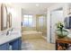 Spa-like bathroom with double sinks, soaking tub, and walk-in shower at 263 Minorca Beach Way # 301, New Smyrna Beach, FL 32169