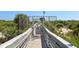 Private gated beach access walkway with boardwalk path at 263 Minorca Beach Way # 301, New Smyrna Beach, FL 32169