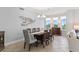 Spacious dining area features a wood table and six chairs at 263 Minorca Beach Way # 301, New Smyrna Beach, FL 32169