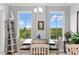 Cozy dining area with a square table and four chairs at 263 Minorca Beach Way # 301, New Smyrna Beach, FL 32169