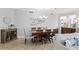 Elegant dining room with a large table and beautiful chandelier at 263 Minorca Beach Way # 301, New Smyrna Beach, FL 32169