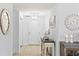 Bright and airy entryway with tiled floors and console table at 263 Minorca Beach Way # 301, New Smyrna Beach, FL 32169