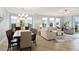Bright living room features ample seating, large windows, and a view at 263 Minorca Beach Way # 301, New Smyrna Beach, FL 32169