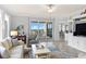 Open living space with balcony access and city views at 263 Minorca Beach Way # 301, New Smyrna Beach, FL 32169
