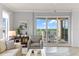 Comfortable living room featuring large windows and balcony access at 263 Minorca Beach Way # 301, New Smyrna Beach, FL 32169