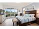King-size bedroom with private balcony access and beautiful water views at 263 Minorca Beach Way # 301, New Smyrna Beach, FL 32169