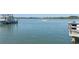 Serene view of calm water with boat passing by at 263 Minorca Beach Way # 301, New Smyrna Beach, FL 32169