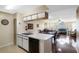 Kitchen with breakfast bar overlooking living room at 3149 Britannia Blvd # B, Kissimmee, FL 34747