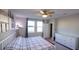 Main bedroom with king-size bed, dresser, and access to backyard at 3211 Bella Vista Dr, Davenport, FL 33897