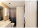 Simple bathroom with shower/tub, vanity, and white cabinet at 3700 Idlebrook Cir # 208, Casselberry, FL 32707