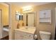 Clean bathroom with vanity, mirror, and toilet at 3700 Idlebrook Cir # 208, Casselberry, FL 32707