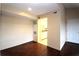 Simple dining area with wood floors and view into kitchen at 3700 Idlebrook Cir # 208, Casselberry, FL 32707