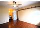 Main bedroom with ceiling fan, wood floors, and built-in shelving at 3700 Idlebrook Cir # 208, Casselberry, FL 32707