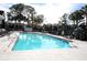 Inviting community swimming pool with surrounding lounge area at 3700 Idlebrook Cir # 208, Casselberry, FL 32707