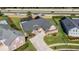 Aerial view of house and driveway from the street at 5210 Sailwind Cir, Orlando, FL 32810