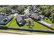 Aerial view of house, pool, and backyard with surrounding neighborhood at 5210 Sailwind Cir, Orlando, FL 32810