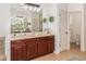 Elegant bathroom with double vanity, large soaking tub, and separate shower at 5210 Sailwind Cir, Orlando, FL 32810
