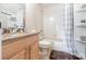 Simple bathroom with a shower/tub combo and built in shelving at 5210 Sailwind Cir, Orlando, FL 32810