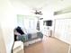 Bright, cozy bedroom with ample natural light, ceiling fan, and closet at 5210 Sailwind Cir, Orlando, FL 32810