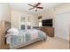 Spacious bedroom with a wooden bed frame and private access to a patio at 5210 Sailwind Cir, Orlando, FL 32810