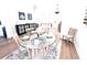 Inviting dining room featuring modern décor, hardwood floors, and elegant chandelier at 5210 Sailwind Cir, Orlando, FL 32810
